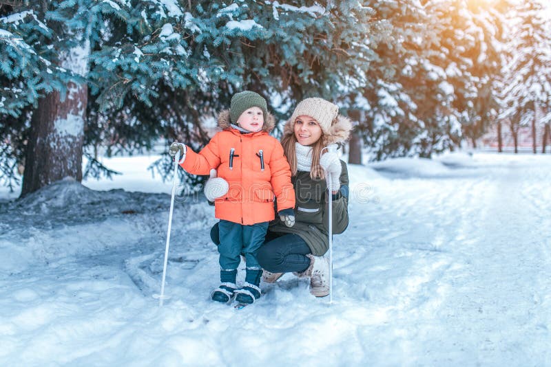 Mom and Son in Winter Park, Skiing on Children. Happy Smiling, Relaxing ...