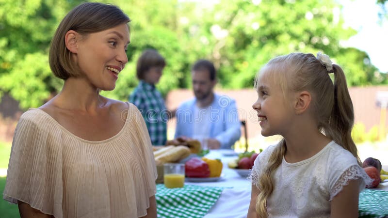 Mom talking to daughter while dad having conversation with son, trust relations royalty free stock images Mom talking to daughter while dad having conversation with son, trust relations royalty free stock images