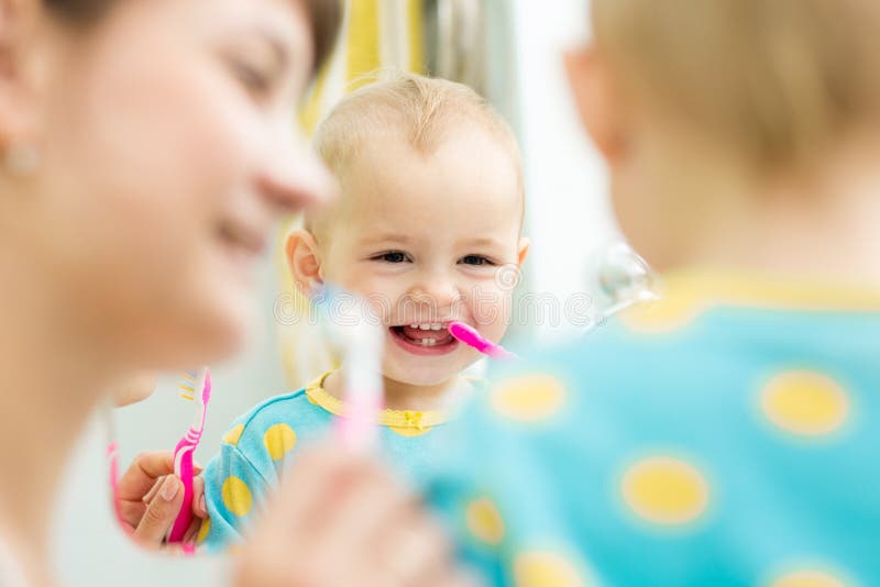 Mom Teaches Baby Brushing Teeth Stock Image Image of mirror, indoors