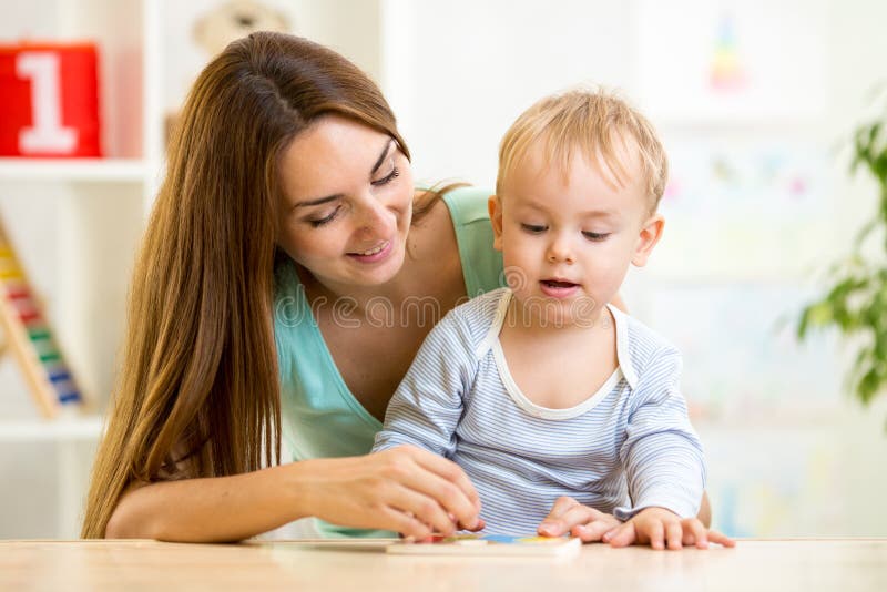 Mom Teaching Her Son Solve Puzzle Stock Photo Image 58210418