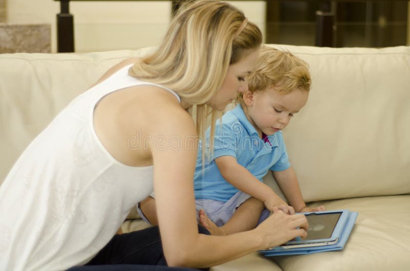 Mom Teaching Her Son To Use Tablet Stock Image Image Of Bea