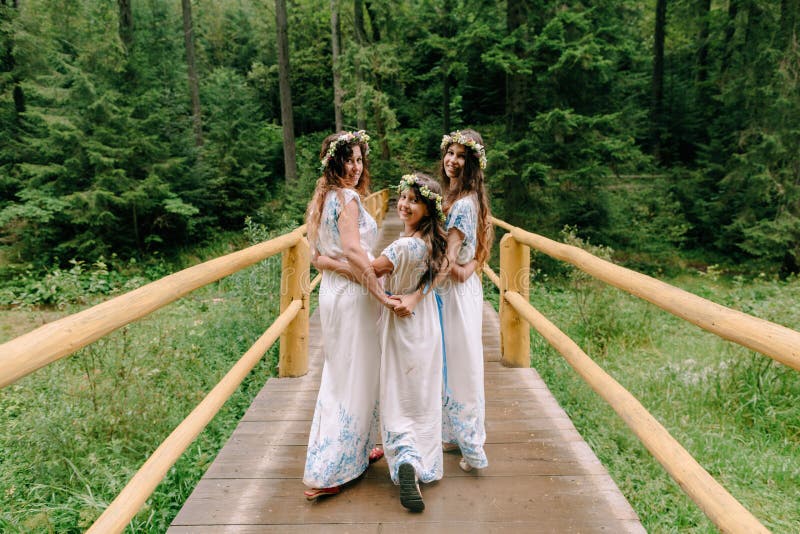 Mom and Two Daughters Walking Near the Lake . Stock Image - Image of ...