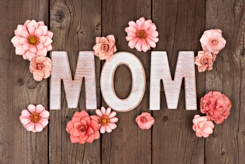MOM Wooden Letters with Paper Flowers Over Rustic Wood Stock Image ...