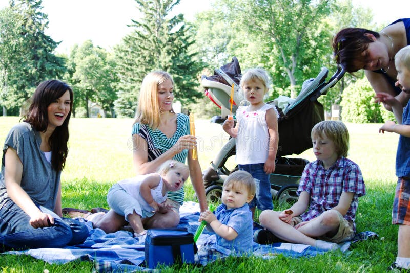 Moms and children at park