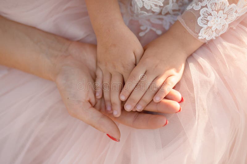 Moms Hand Holds In Her Palm The Hands Of Her Little Daughter Stock Image Image of holds, love