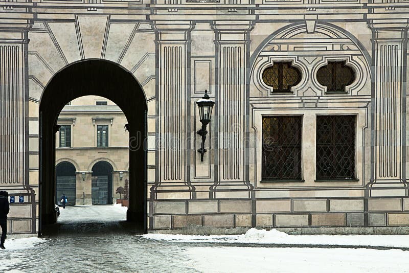 Munich, Germany - Suggestive winter view of the passage between two courtyards of the Residenz, royal palace of the former Bavarian kings, in Renaissance Italian style with the facades painted with forced perspective decorations. Munich, Germany - Suggestive winter view of the passage between two courtyards of the Residenz, royal palace of the former Bavarian kings, in Renaissance Italian style with the facades painted with forced perspective decorations