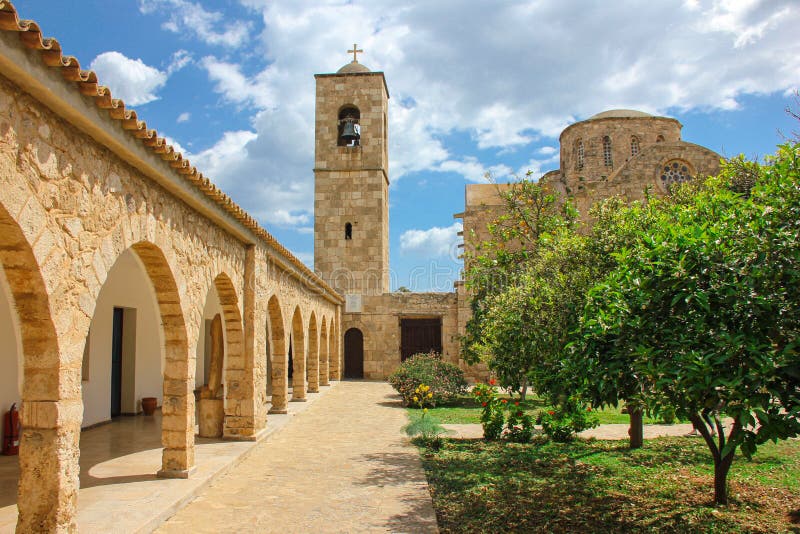 Monastery of St. Barnabas in Cyprus and Blooming Oranges Trees Stock