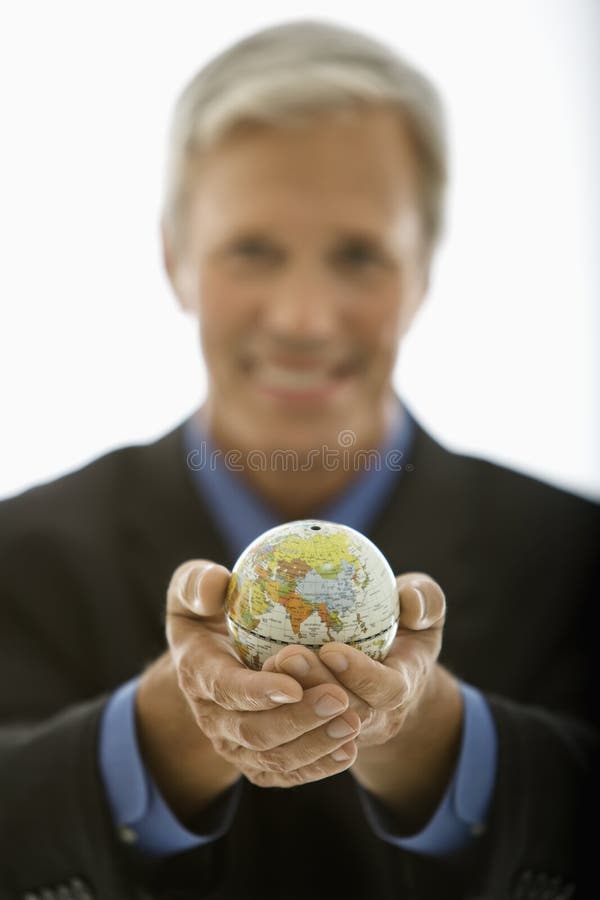 Mondo della holding dell'uomo d'affari. fotografia stock