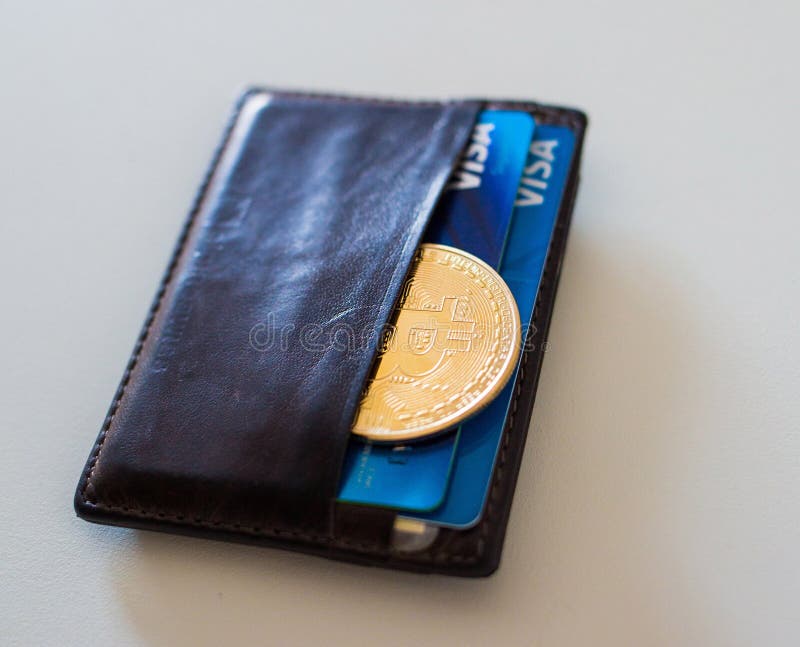 Moneda de Bitcoin en la cartera foto de archivo Moneda de Bitcoin en la cartera foto de archivo