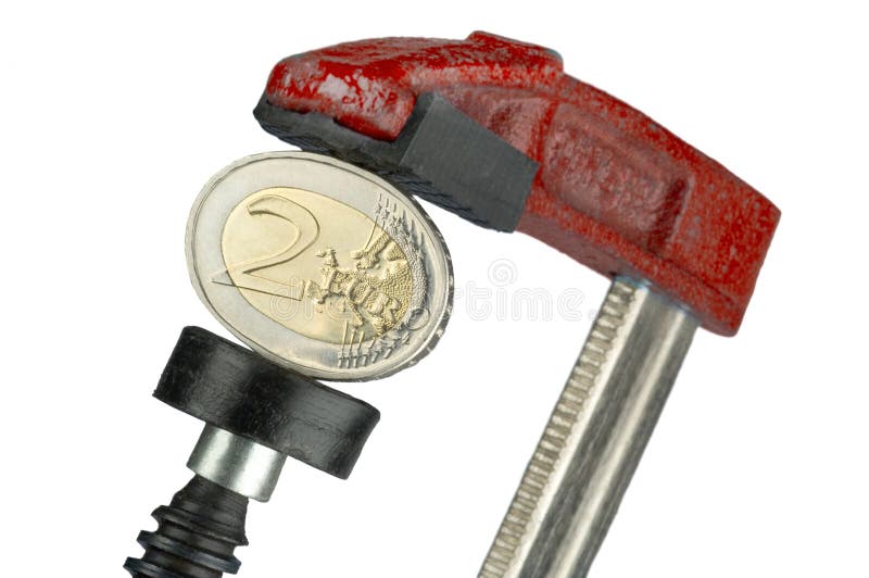 Moneda euro de Flatted en una abrazadera imagen de archivo libre de regalías Moneda euro de Flatted en una abrazadera imagen de archivo libre de regalías