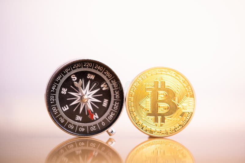 Moneta e bussola di Bitcoin immagine stock libera da diritti
