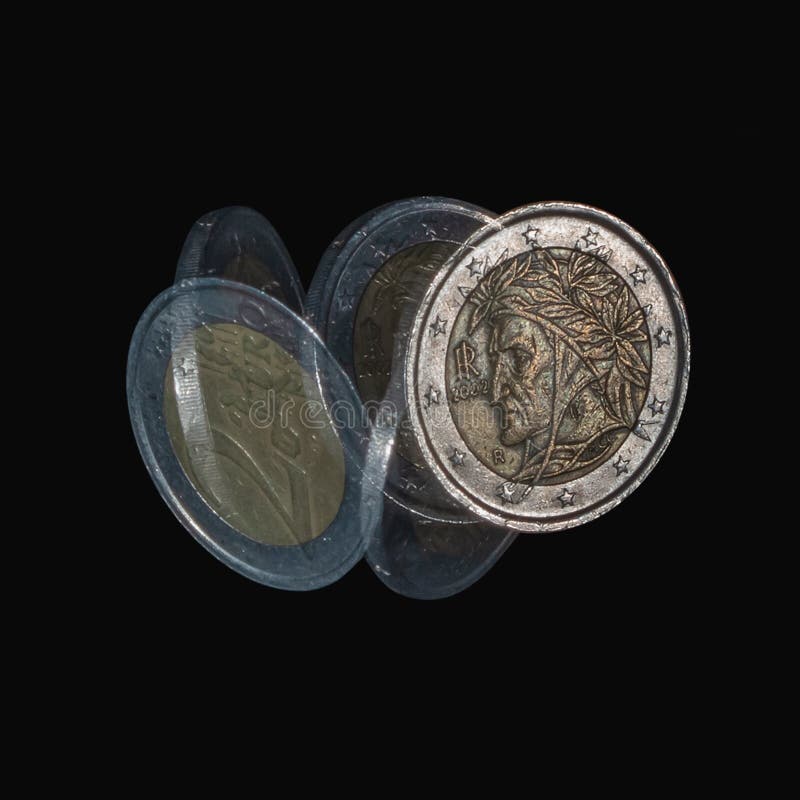 Spinning coin in stroboscopic light isolated on black background, close up. Two euro coin with Dante Alighieri. Stroboscopic effect. Spinning coin in stroboscopic light isolated on black background, close up. Two euro coin with Dante Alighieri. Stroboscopic effect