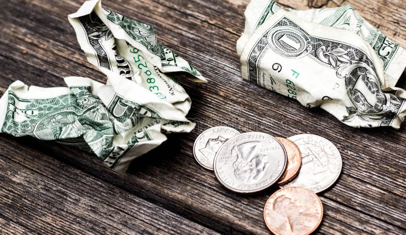 money-change-coins-dollars-dollar-bills-crumpled-close-up-table-88310918.jpg