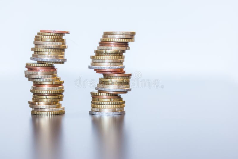 Money concept: Coins tacked on each other. Inflation, currency, savings, money