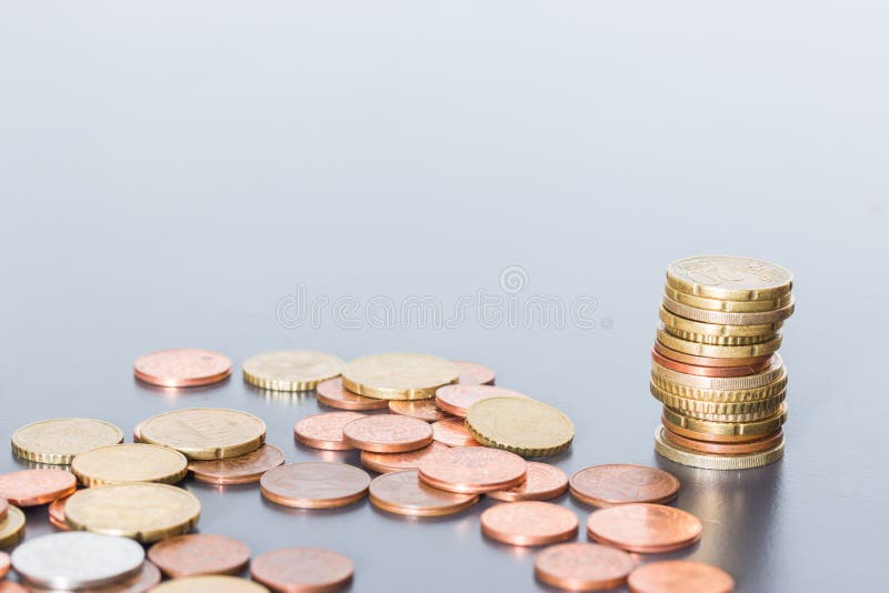 Money concept: Coins tacked on each other. Inflation, currency, savings, money