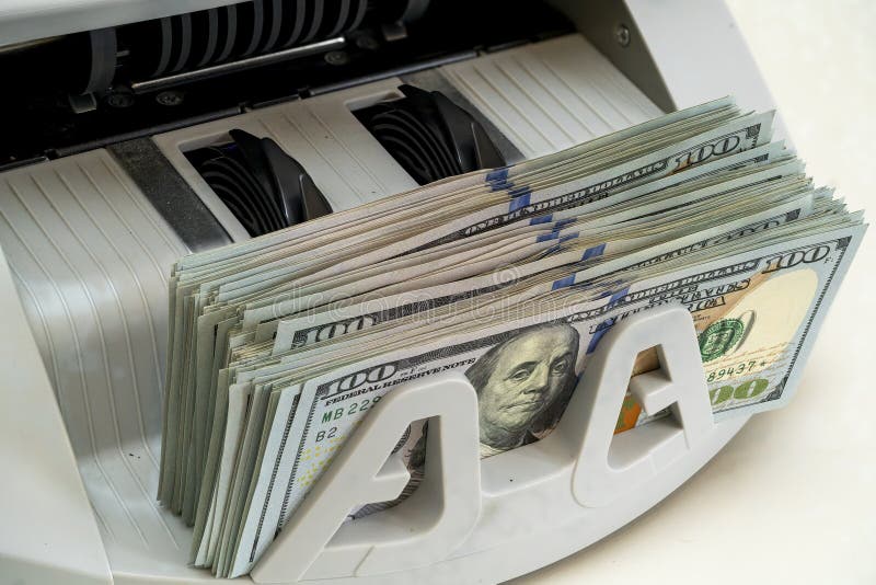 Money counting machine in use at a financial office stock photography
