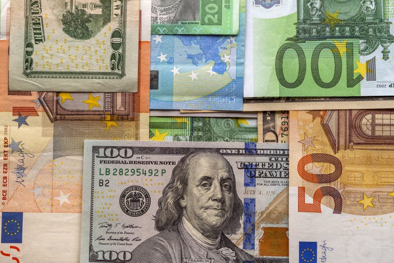 Money and finances concept. One hundred dollar new bill on colorful abstract background of euro national currency banknotes stock images Money and finances concept. One hundred dollar new bill on colorful abstract background of euro national currency banknotes stock images