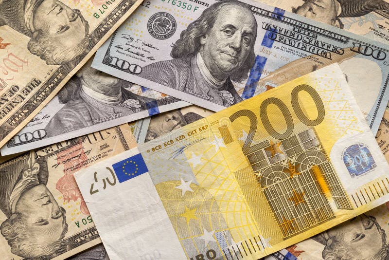 Money and finances concept. Two hundred euro new bill on colorful abstract background of American national currency, dollar royalty free stock photos Money and finances concept. Two hundred euro new bill on colorful abstract background of American national currency, dollar royalty free stock photos