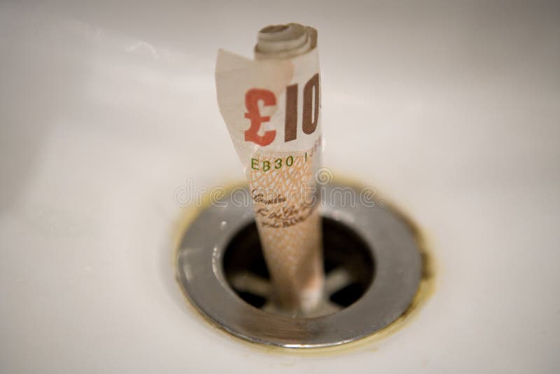 Money going down the drain editorial photo. Image of poor 11901251