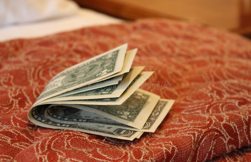 Money on hotel bed stock photo. Image of ready, full 20290436