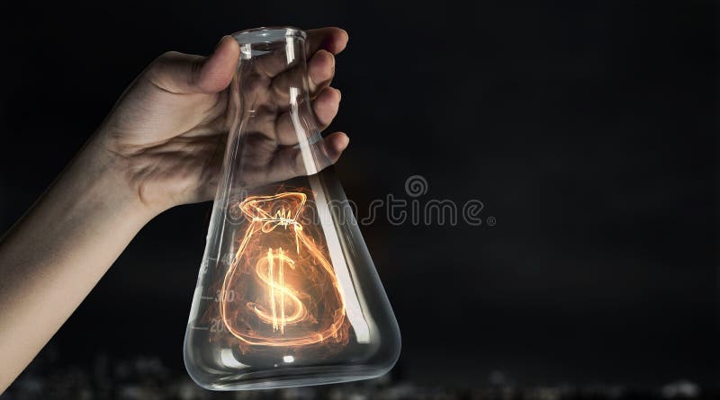 Hand holding glass test tube with money sign inside. Hand holding glass test tube with money sign inside