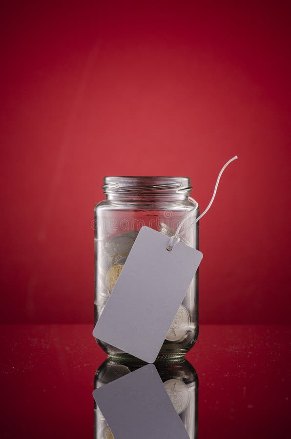 Money savings concept , glass jar full with coins. royalty free stock photography Money savings concept , glass jar full with coins. royalty free stock photography