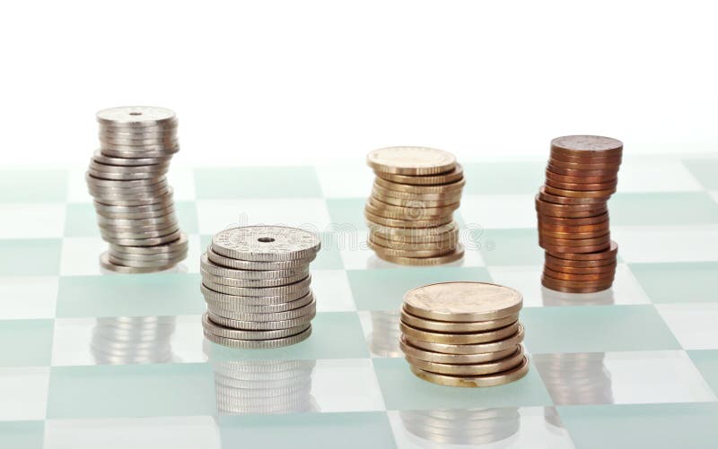 Money strategy. Concept with several stacks of money, placed on a chess board stock photos Money strategy. Concept with several stacks of money, placed on a chess board stock photos