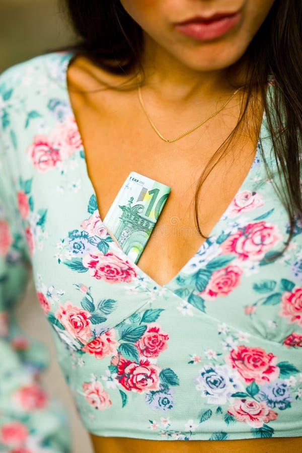 Money in woman`s neckline royalty free stock image Money in woman`s neckline royalty free stock image