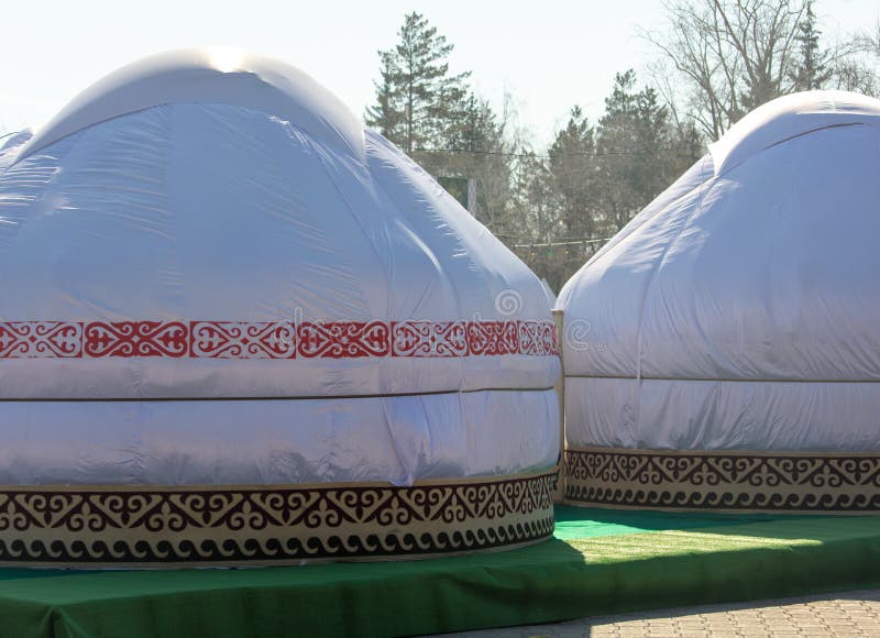 Mongolian yurt on the grass in the park. Mongolian yurt on the grass in the park.