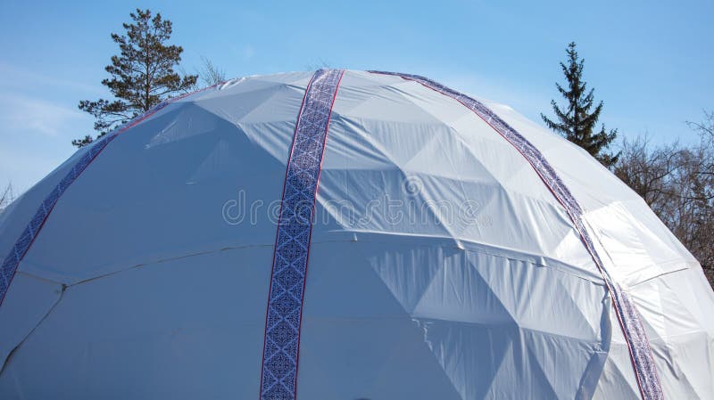 Mongolian yurt on the grass in the park. Mongolian yurt on the grass in the park.