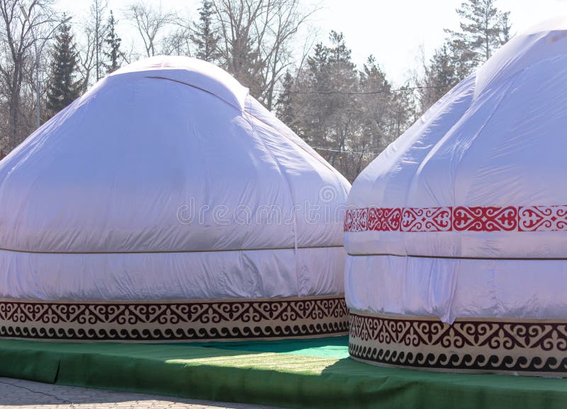 Mongolian yurt on the grass in the park. Mongolian yurt on the grass in the park.