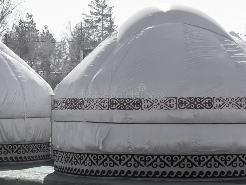 Mongolian yurt on the grass in the park. Mongolian yurt on the grass in the park.