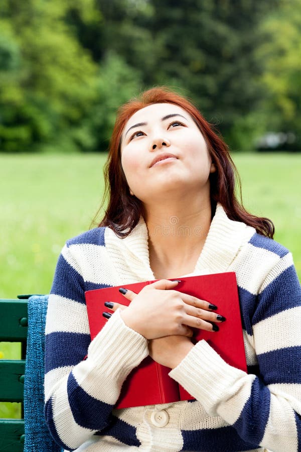 Mongolian woman reading book stock image