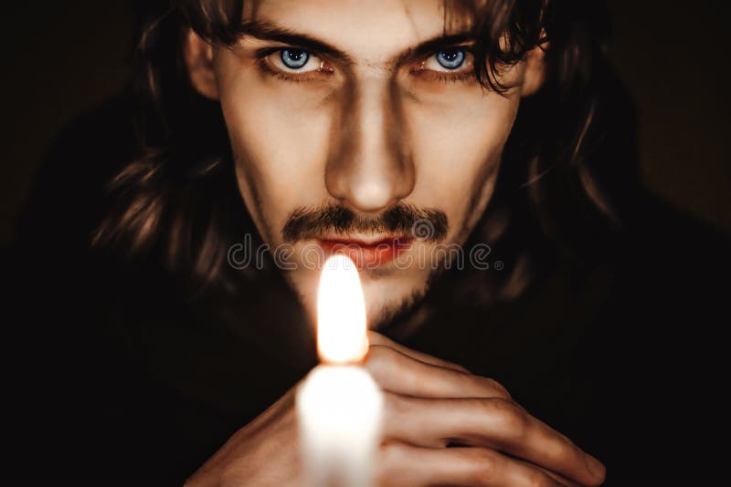 A monk with a candle stock photography