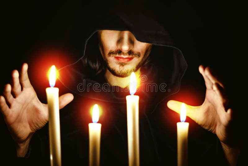 A monk with a candle stock images