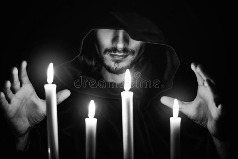 A monk with a candle royalty free stock images