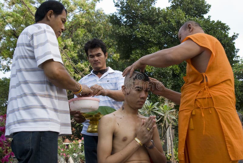 Monk shaving head royalty free stock images