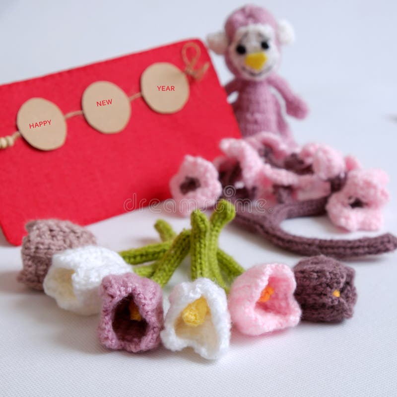 2016, year of monkey, handmade happy new year on white background, knitted monkey, funny stuffed animal, knit flower from yarn, red envelope for lucky money, sign for Vietnam Tet. 2016, year of monkey, handmade happy new year on white background, knitted monkey, funny stuffed animal, knit flower from yarn, red envelope for lucky money, sign for Vietnam Tet