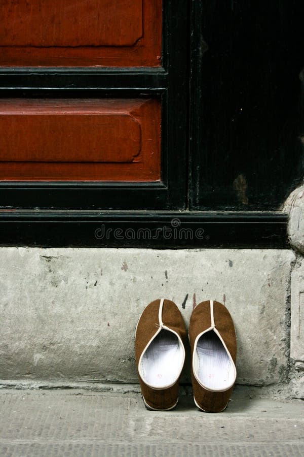 monks chinese slippers placed outside temple door 12490116