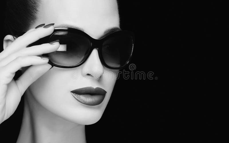 Monochrome stylish woman face with trendy sunglasses. High fashion portrait