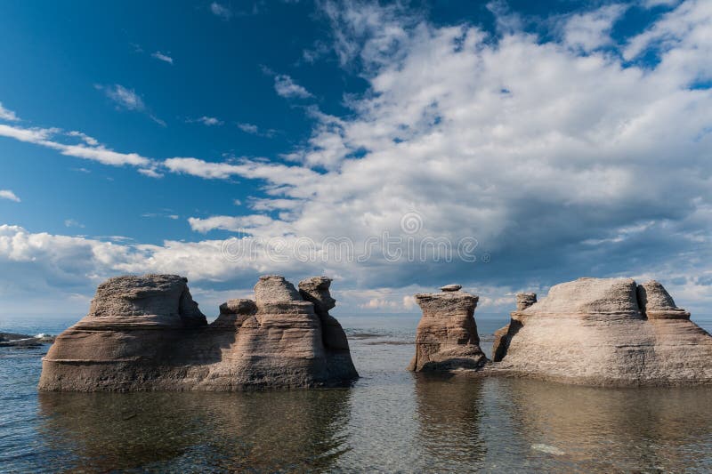 Monoliths on a cloudy sky in Mingan