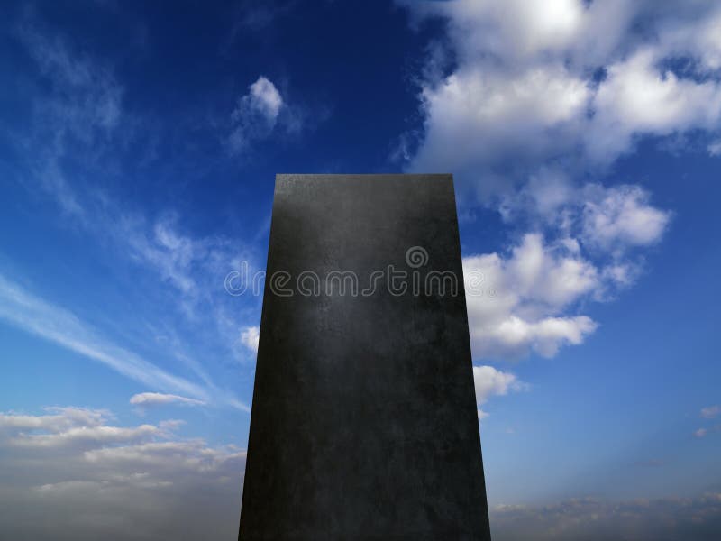 Gray monolith between the clouds in the blue sky. Gray monolith between the clouds in the blue sky