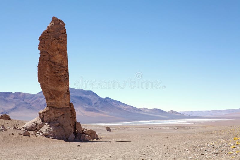 Geological monolith close to Salar the Tara in the Los Flamencos National Reserve, Chile. It is an impressiv volcanic column modified by erosion at 4870 meters above the sea level. Geological monolith close to Salar the Tara in the Los Flamencos National Reserve, Chile. It is an impressiv volcanic column modified by erosion at 4870 meters above the sea level.