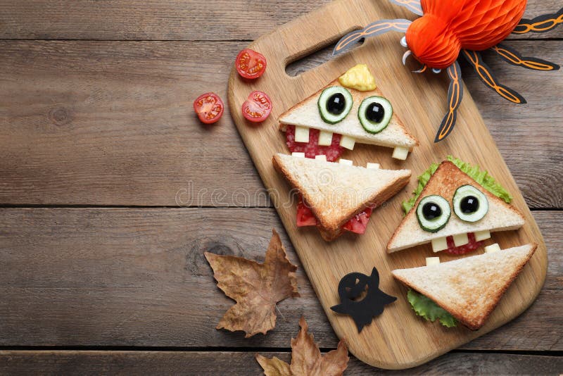 Cute Monster Sandwiches Served on Wooden Table, Flat Lay with Space for ...