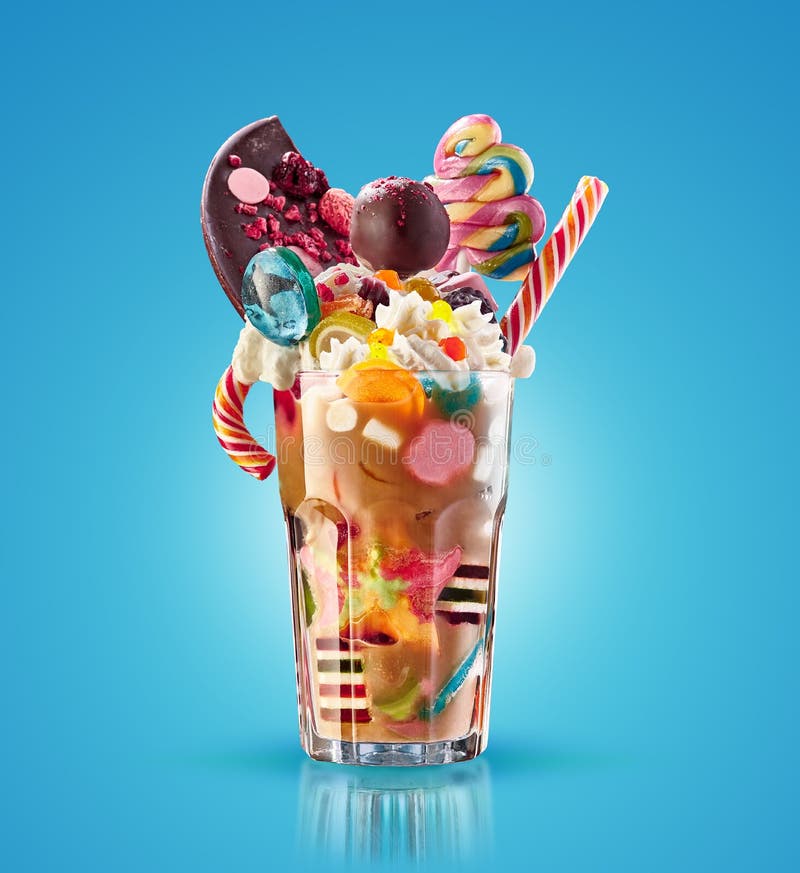 Monster shake, freak caramel shake isolated. Colourful, festive milk shake cocktail with sweets, jelly. Colored caramel