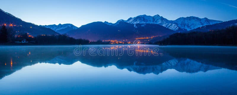 Mont Blanc Massif and reflection captured from the edge of Lac du Passy, Passy, France. Located in the Arve Valley, France, between Geneva, Switzerland and Chamonix, Mont Blanc. Mont Blanc Massif and reflection captured from the edge of Lac du Passy, Passy, France. Located in the Arve Valley, France, between Geneva, Switzerland and Chamonix, Mont Blanc.