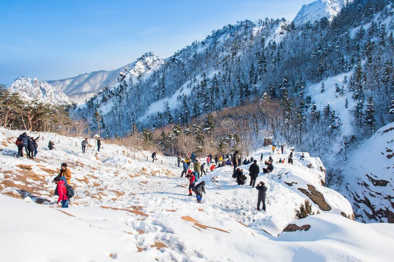 SEORAKSAN,KOREA - FEBRUARY 21: Tourists taking photos of the beautiful scenery around Seoraksan,South Korea on February 21, 2015. SEORAKSAN,KOREA - FEBRUARY 21: Tourists taking photos of the beautiful scenery around Seoraksan,South Korea on February 21, 2015.