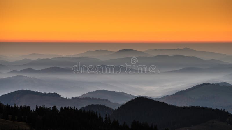 Bucovina autumn sunrise landscape in Romania with mist and mountains, aerial view from drone. Bucovina autumn sunrise landscape in Romania with mist and mountains, aerial view from drone