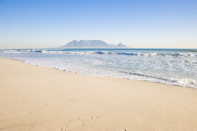 Table Mountain - the world famous landmark in Cape Town, South Africa. Picture taken on a clear Winters day from the Blouberg Strand beach. Table Mountain - the world famous landmark in Cape Town, South Africa. Picture taken on a clear Winters day from the Blouberg Strand beach.