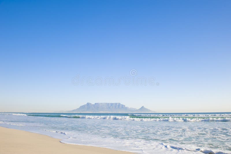 Table Mountain - the world famous landmark in Cape Town, South Africa. Picture taken on a clear Winters day from the Blouberg Strand beach. Table Mountain - the world famous landmark in Cape Town, South Africa. Picture taken on a clear Winters day from the Blouberg Strand beach.